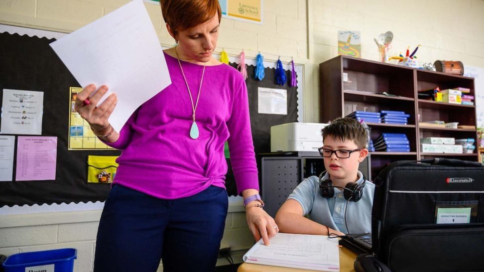Lawrence School Teacher Helping a Student